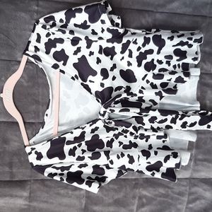 Cow print shirt that ties in the front. Very soft material. Size Large